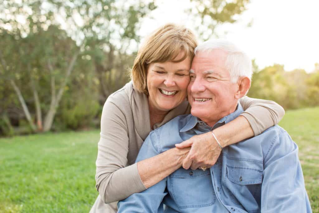 Happy senior mature couple in love outside in nature